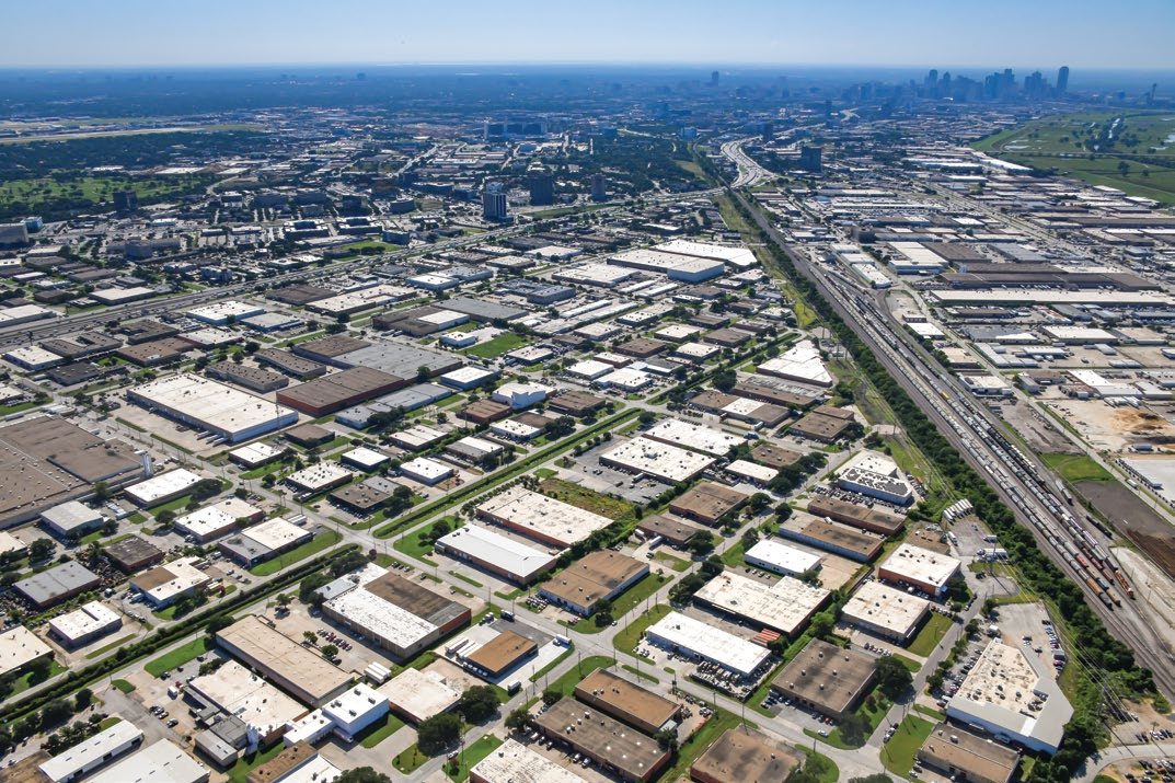 8816-8820 Directors Row — wide aerial with Downtown Dallas skyline